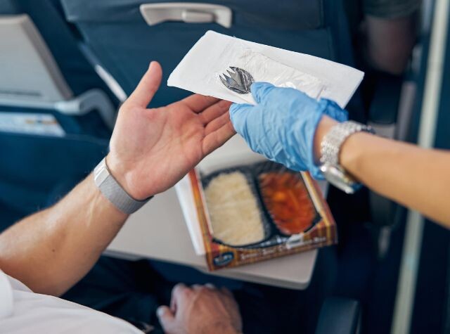 ecofriendly business travel green sustainable toiletries airlines plane plastic cutlery